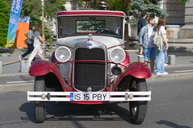4 - Vintage automobile Ford Model A from the late 1920s or early 1930s, featuring a distinctive red and cream two-tone paint scheme